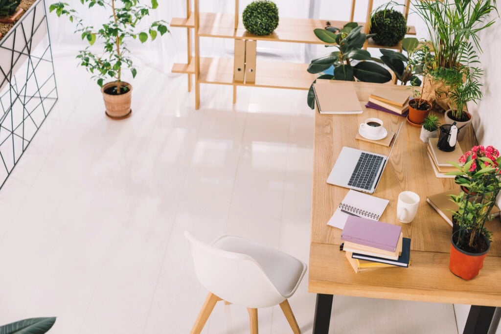 High angle view of interior of business office with plant for article about how to figure out how much money you need to retire comfortably